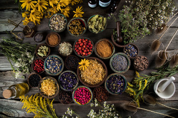 Herbs medicine and vintage wooden background