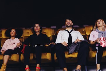 group of people watching movie at cinema