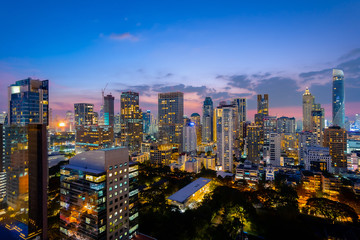 Fototapeta na wymiar Cityscape night view of Bangkok modern City business building and high skyscraper at Bangkok,Thailand.