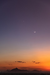Crescent moon with beautiful sunset background . Generous Ramadan stars