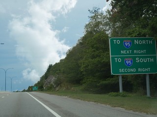 Directional signs along the road at Jamestown, Rhode Island pointing to the north and south...