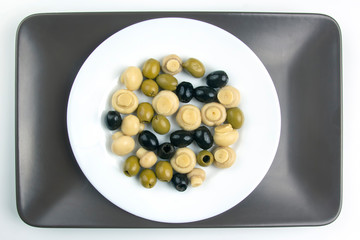 salad of black and green olives on a plate. food and vegetables. diet and weight loss