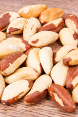 Heap of brazil nuts on rustic boards