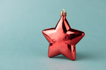 Decorative Christmas toy in the form of star on decorative background.