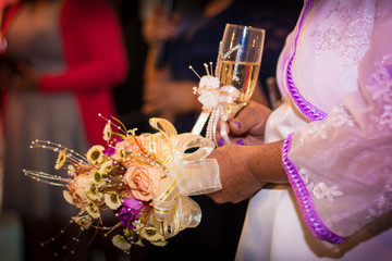 bride and groom holding glasses of champagne