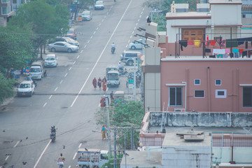 Dusty sunrise in Mandalay Myanmar downtown city skyline.