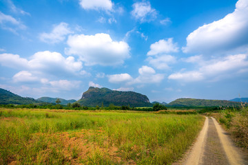 Fototapeta na wymiar beautiful blue sky green forest mountains lake view at Kaeng Krachan National Park, Thailand. an idea for backpacker hiking on long weekend or a couple, family holiday activity camping relaxing