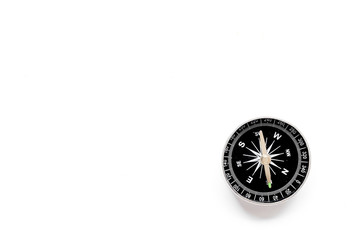 Compass - small and stylish - on white background top view copy space
