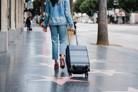 young woman with luggage