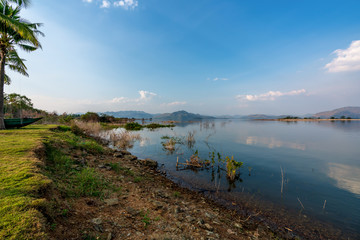 beautiful blue sky green forest mountains lake view at Kaeng Krachan National Park, Thailand.  an idea for backpacker hiking on long weekend or a couple, family holiday activity camping relaxing