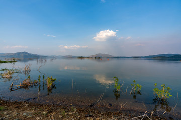 beautiful blue sky green forest mountains lake view at Kaeng Krachan National Park, Thailand.  an idea for backpacker hiking on long weekend or a couple, family holiday activity camping relaxing