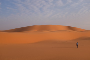 Fototapeta na wymiar A man alone in the desert near Riyadh, Saudi Arabia
