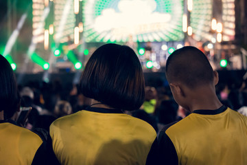 The youth in the concerts have very bright lights at night.