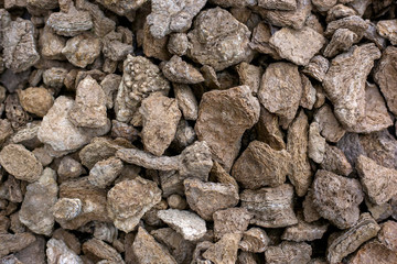 Rough stones rubble background. Grunge brown rock textured.