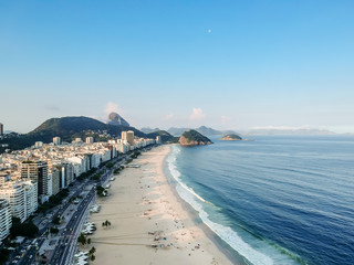 aerial drone view of Copacabana beachs during late afternoon,, some shadows can be seen on the...
