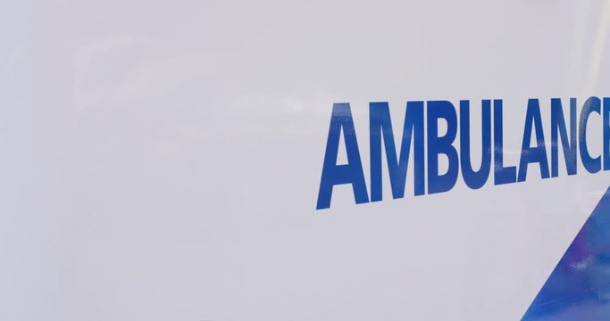 Rack focus to Toronto Ambulance side - slow motion - shot on RED