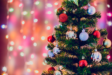 Christmas decoration star and balls Hanging on pine branches christmas tree