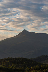 Foggy morning landscape on a green mountain scenic view in Pyrenees