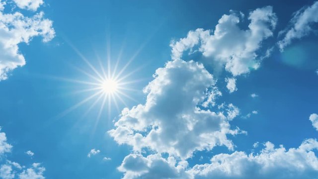 Time lapse of the sun shining bright on blue sky and clouds movement in the day for use concepts natural composition background
