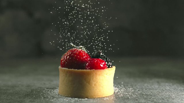 Powdered Sugar Falling on Fruit Tart in Slow Motion
