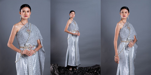 Blue Silver Dress of Thai Traditional Costume or South East Asia gold Dress in Asian Woman with decoration stand in many poses under Studio lighting grey background, collage group pack