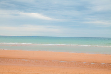 Fototapeta na wymiar Coastal beach landscape scene of sand and water