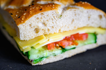 Flatbread sandwich with cheese tomato cucumber salad and sauce