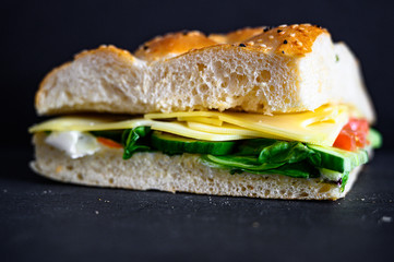 Flatbread sandwich with cheese tomato cucumber salad and sauce