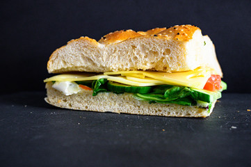 Flatbread sandwich with cheese tomato cucumber salad and sauce