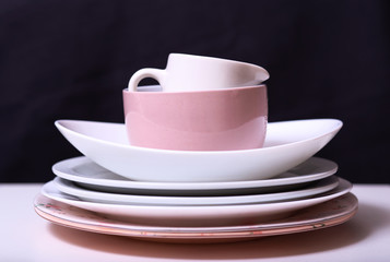 empty plates stacked on a white table