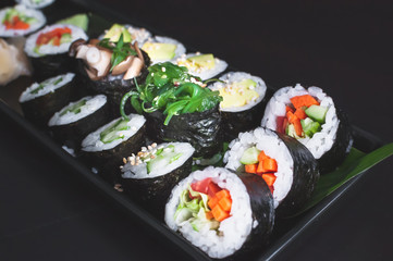 Vegan sushi platter with  maki, futomaki and gunkans.