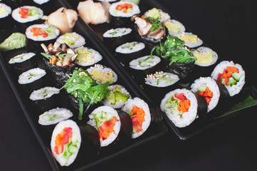 Two vegan sushi platter with  maki, futomaki and gunkans.