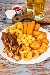 Assortment of beer in assortment on a white plate