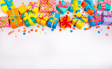 Fototapeta na wymiar bright colored boxes with gifts on a white background for Christmas, birthday, thanksgiving, Valentine's Day