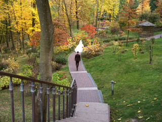 Fototapeta premium wedding couple on the walk in the autumn (fall) park 