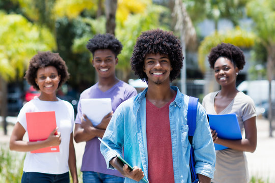 African american university student with group of african american students
