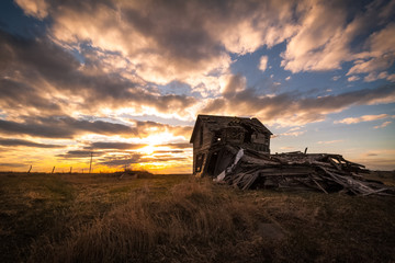 abandoned barn at sunset