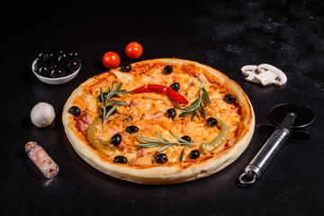 Tasty fresh hot pizza against a dark background. Pizza, food, vegetable, mushrooms.  It can be used as a background