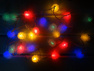 abstract christmas lights garland cones blurs background