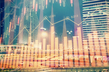 Obraz premium Financial chart on city scape with tall buildings background multi exposure. Analysis concept.