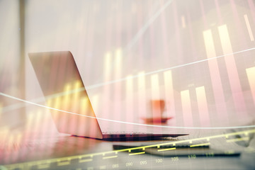 Multi exposure of graph and financial info and work space with computer background. Concept of...