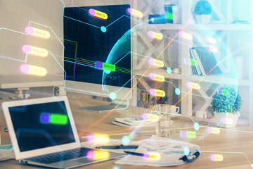 Multi exposure of table with computer and world map hologram. International data network concept.