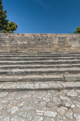 Fototapeta na wymiar Ancient stone staircase among ancient ruins