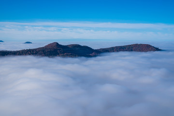 Germany, Impressive aerial view above endless sea of clouds in valley of swabian jura nature...