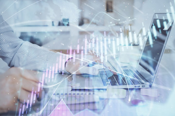 Multi exposure of stock market chart with man working on computer on background. Concept of financial analysis.