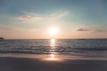 Retro tone with lot of contrast beach in wide view. Sunset time have less cloud in afternoon. Black sand from ore and Crude oil
