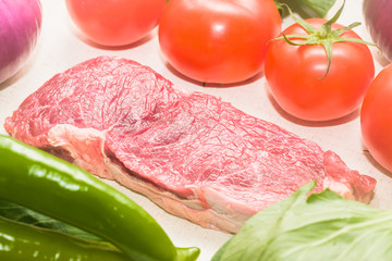 Raw beef with fresh vegetable shed pats