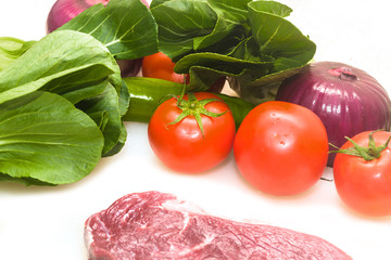 Raw beef with fresh vegetable shed pats