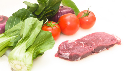 Raw beef with fresh vegetable shed pats