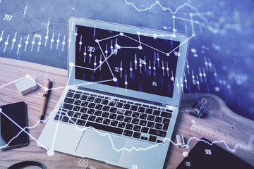 Multi exposure of chart and financial info and work space with computer background. Concept of international online trading.